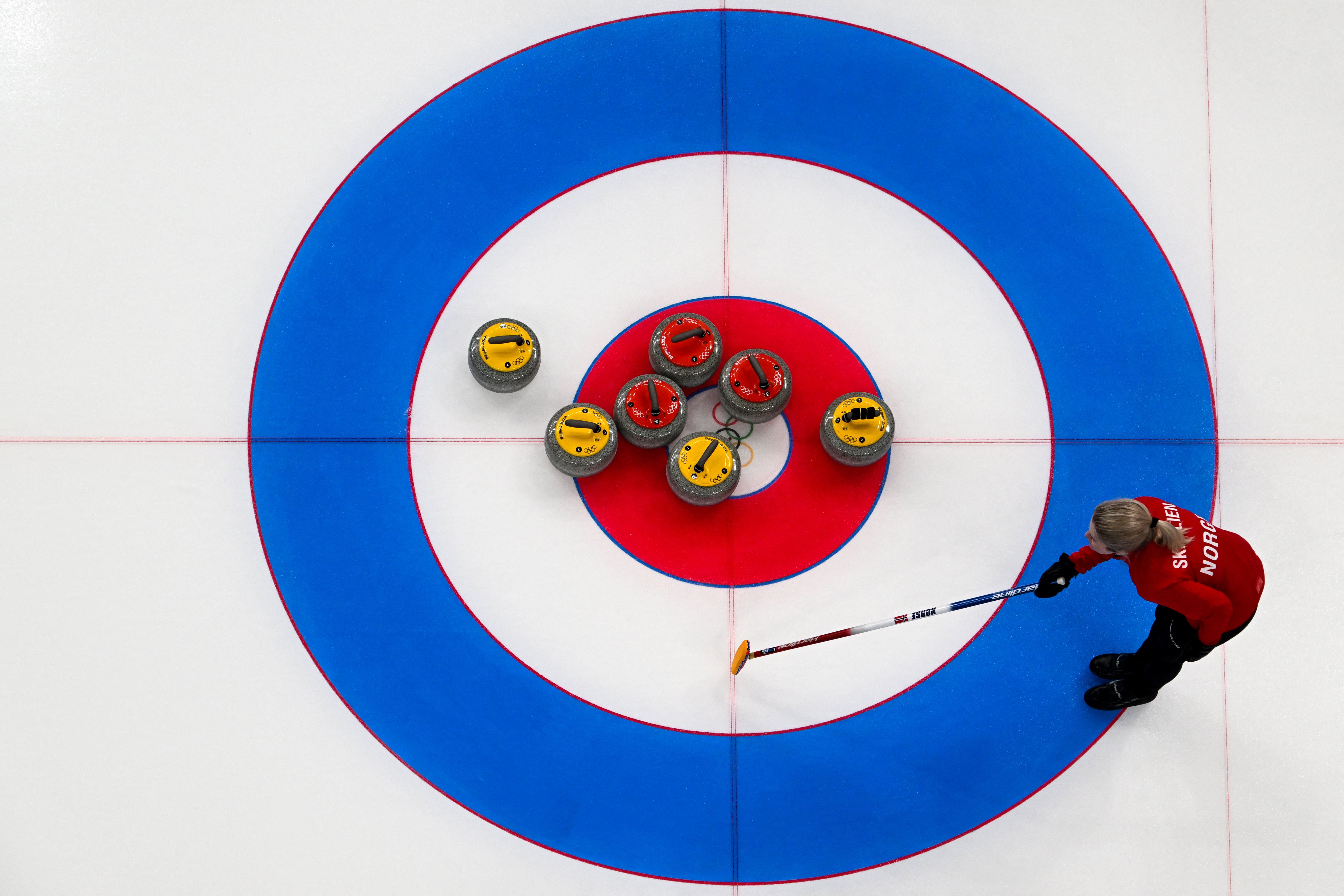 What Does the Hammer Symbol Mean in Curling